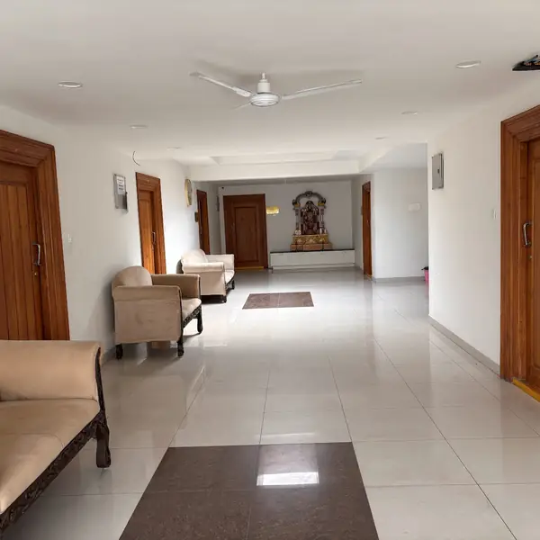 Lobby corridor with sofa seating and the shrine at the far end