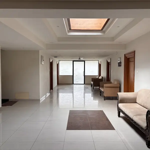 Long, bright lobby with sofa seating