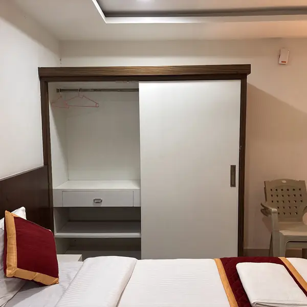 Sliding wardrobe beside the bed