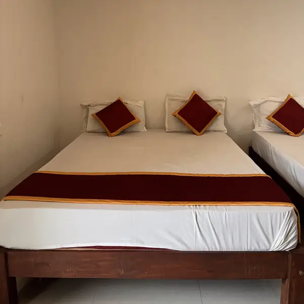Bed with fresh linen and silk cushions